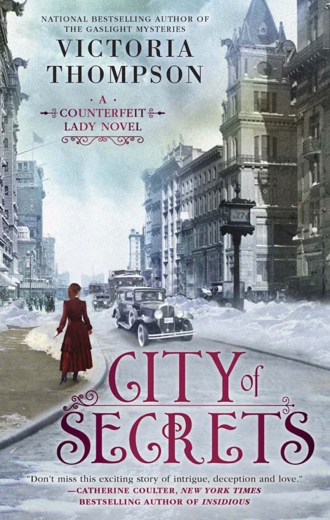 City of Secrets by Victoria Thompson book cover shows New York City street in the early 1900s. Snow is on the ground. An early car drives by, and a woman in red walks on the sidewalk.