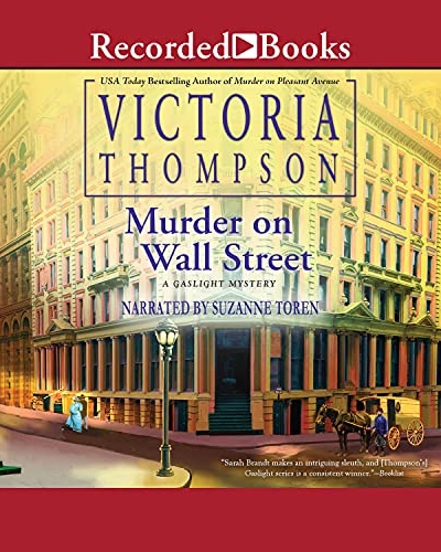 Murder on Wall Street by Victoria Thompson audio book cover shows a corner building in New York City in the early 1900s. It's early morning and the sky is yellow. Gas street lamps are lit. A horse and carriage pass by and a man and woman walk by.