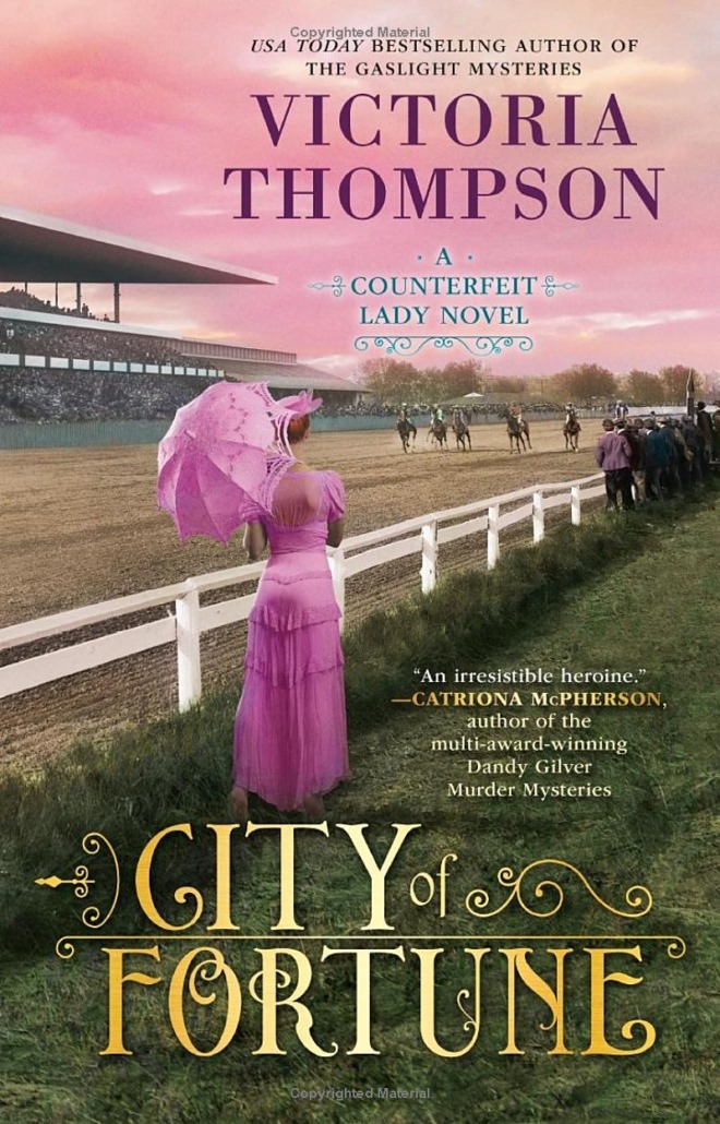 City of Fortune by Victoria Thompson book cover shows a woman in early 1900s clothing, a pink dress with a pink parasol, strolls by a horse race at dusk. The sky is pink.