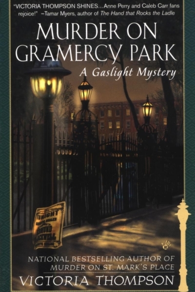 Cover of Murder on Gramercy Park by Victoria Thompson. Wrought iron gates to a park are lit by gas lamps on a misty night. A newspaper is blowing in the wind.
