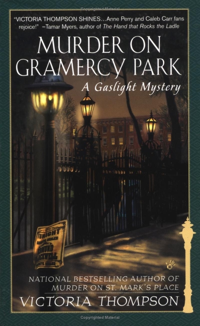 Cover of Murder on Gramercy Park by Victoria Thompson. Wrought iron gates to a park are lit by gas lamps on a misty night. A newspaper is blowing in the wind.